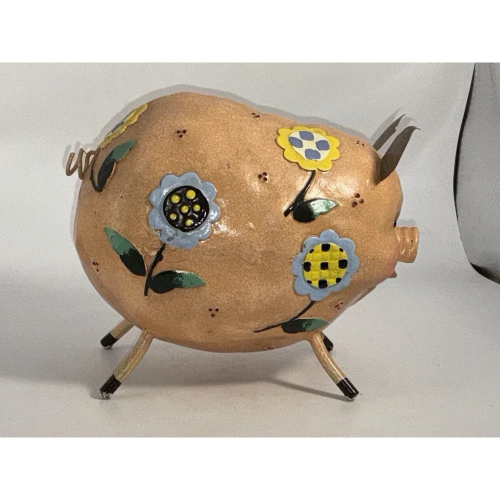 Floral Decorated Pig With Curly Tail And Cute Ears Made Of Metal?